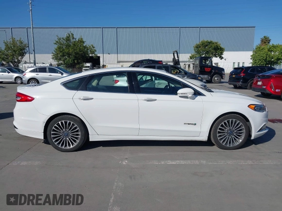 2017 Ford Fusion Hybrid Titanium с VIN 3FA6P0RU3HR323164, выставлен на аукционе IAAI как лот 42303571 с пробегом 119 732 миль миль и . История ставок и продаж доступна на DreamBid. Изображение 14.