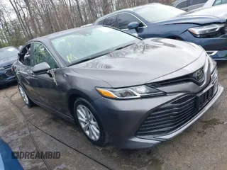2019 Toyota Camry LE z VIN 4T1B11HKXKU180922, wystawiony jako IAAI lot #41919406 z przebiegiem 161 069 mil mil oraz . Historia ofert i sprzedaży dostępna na DreamBid. Obrazek 1.