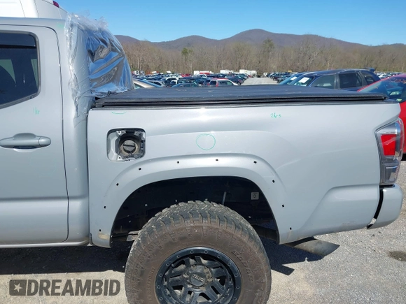 2020 Toyota Tacoma SR5 z VIN 5TFCZ5AN5LX229019, wystawiony jako IAAI lot #41907694 z przebiegiem 79 355 mil mil oraz . Historia ofert i sprzedaży dostępna na DreamBid. Obrazek 22.