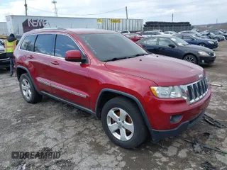 2012 Jeep Grand Cherokee Laredo with VIN 1C4RJFAG7CC221682, listed as a IAAI auction lot 41881922 with 218,762 mi miles. Bid and sale history available at carsss.com. Image 1.