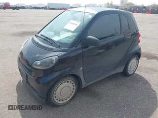 2009 Smart fortwo Pure z VIN WMEEJ31X59K312270, wystawiony jako IAAI lot #41910686 z przebiegiem 111 107 mil mil oraz . Historia ofert i sprzedaży dostępna na DreamBid. Obrazek 2.