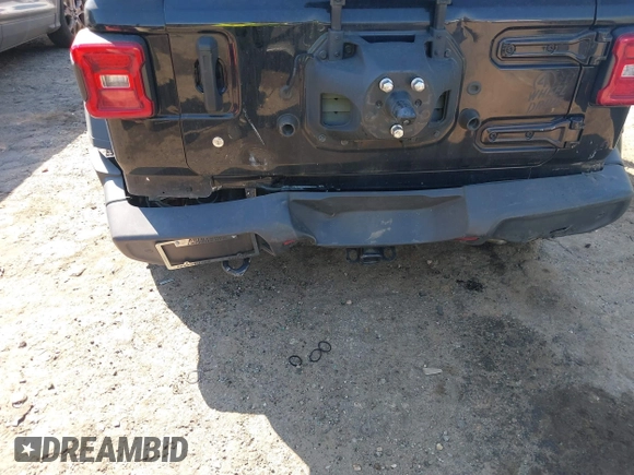 2020 Jeep Wrangler Unlimited Black and Tan with VIN 1C4HJXDGXLW219078, listed as a IAAI auction lot 41783437 with 59,137 mi miles and . Bid and sale history available at DreamBid. Image 6.
