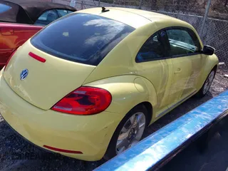 2012 Volkswagen Beetle 2.5L PZEV with VIN 3VWJP7AT4CM603419, listed as a IAAI auction lot 41736444 with 111,647 mi miles. Bid and sale history available at carsss.com. Image 4.