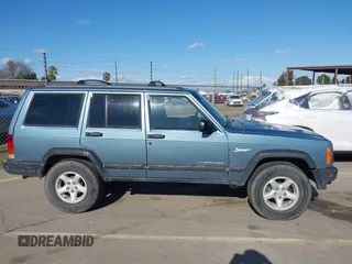 1998 Jeep Cherokee Sport with VIN 1J4FT68S0WL231959, listed as a IAAI auction lot 41680076 with 252,369 mi miles. Bid and sale history available at carsss.com. Image 13.