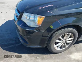 2014 Dodge Grand Caravan SXT with VIN 2C4RDGCG4ER341699, listed as a IAAI auction lot 42064523 with 234,422 mi miles and . Bid and sale history available at DreamBid. Image 6.
