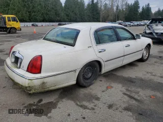 2001 Lincoln Town Car Executive z VIN 1LNHM81W91Y729914, wystawiony jako Copart lot #41593085 z przebiegiem 144 950 mil mil oraz Czysty tytuł • Clean title. Historia ofert i sprzedaży dostępna na DreamBid. Obrazek 3.