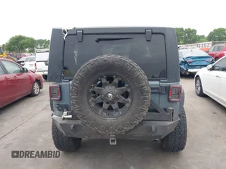 2015 Jeep Wrangler Sport with VIN 1C4GJWAG7FL585631, listed as a IAAI auction lot 41943582 with 88,649 mi miles and . Bid and sale history available at DreamBid. Image 16.