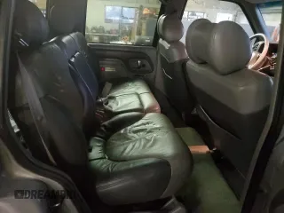 2000 GMC Denali z VIN 1GKEK13R9YR104210, wystawiony jako Copart lot #85599964 z przebiegiem 1 548 394 mil mil oraz Szkody całkowita. Historia ofert i sprzedaży dostępna na DreamBid. Obrazek 11.
