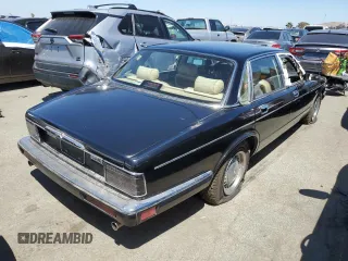 1990 Jaguar XJ with VIN SAJKY1745LC622713, listed as a Copart auction lot 56545414 with Not Provided miles and Salvage Title. Bid and sale history available at DreamBid. Image 3.