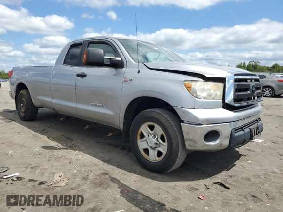 2012 Toyota Tundra 4WD Truck with VIN 5TFCY5F15CX013941, listed as a Copart auction lot 69946754 with 163,228 mi miles and Salvage Title. Bid and sale history available at carsss.com. Image 4.