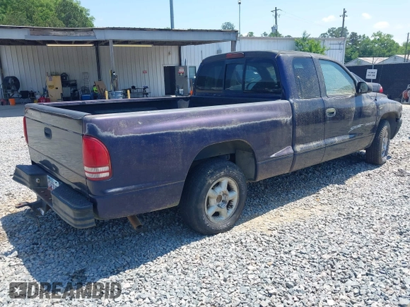 1998 Dodge Dakota SLT with VIN 1B7GL22X3WS569885, listed as a IAAI auction lot 42128994 with 1 mi miles. Bid and sale history available at carsss.com. Image 4.