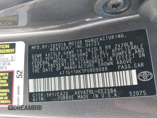 2023 Toyota Camry SE with VIN 4T1G11AK1PU809099, listed as a IAAI auction lot 41450292 with 128,099 mi miles. Bid and sale history available at carsss.com. Image 9.