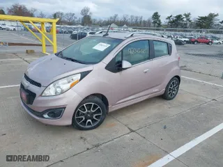 2013 Chevrolet Spark LT with VIN KL8CF6S99DC626296, listed as a IAAI auction lot 42047123 with 63,669 mi miles. Bid and sale history available at carsss.com. Image 2.