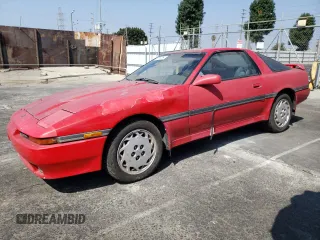 1989 Toyota Supra z VIN JT2MA70J3K0114537, wystawiony jako Copart lot #72587854 z przebiegiem 189 813 mil mil oraz Czysty tytuł • Clean title. Historia ofert i sprzedaży dostępna na DreamBid. Obrazek 1.