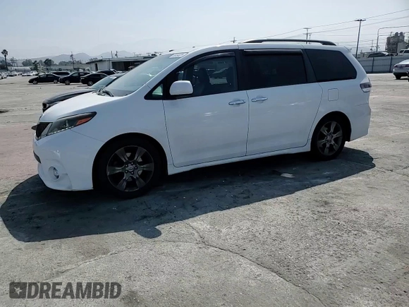 2015 Toyota Sienna SE with VIN 5TDXK3DC7FS601720, listed as a Copart auction lot 59959325 with 262,419 mi miles and Salvage title. Bid and sale history available at DreamBid. Image 14.