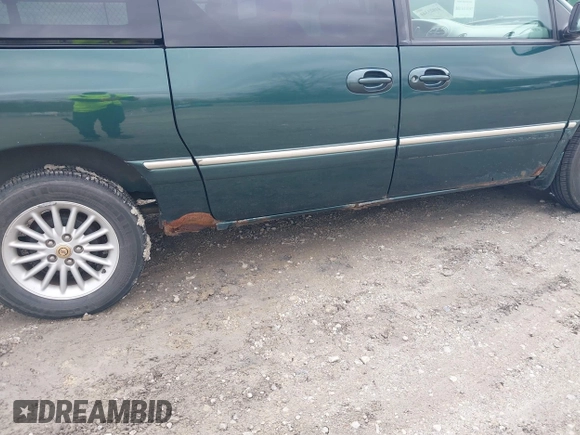 1999 Chrysler Town & Country with VIN 1C4GP54G6XB603564, listed as a IAAI auction lot 41823340 with 104,321 mi miles and . Bid and sale history available at DreamBid. Image 6.