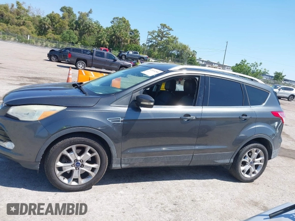 2016 Ford Escape Titanium with VIN 1FMCU0J95GUB11995, listed as a IAAI auction lot 42065255 with 142,390 mi miles. Bid and sale history available at carsss.com. Image 14.