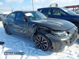 2023 BMW i4 M50 with VIN WBY33AW03PFN81310, listed as a IAAI auction lot 41387873 with 21,586 mi miles. Bid and sale history available at carsss.com. Image 1.