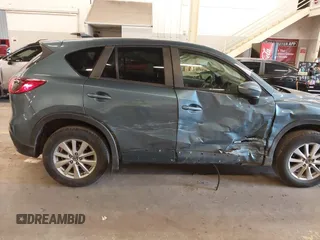 2016 Mazda CX-5 Touring z VIN JM3KE4CY2G0839202, wystawiony jako IAAI lot #41901207 z przebiegiem 65 449 mil mil oraz . Historia ofert i sprzedaży dostępna na DreamBid. Obrazek 6.