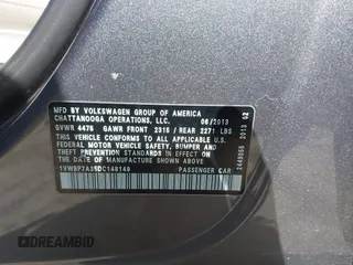 2013 Volkswagen Passat SE w/Sunroof & Nav with VIN 1VWBP7A35DC148149, listed as a IAAI auction lot 42148096 with 228,555 mi miles. Bid and sale history available at carsss.com. Image 9.