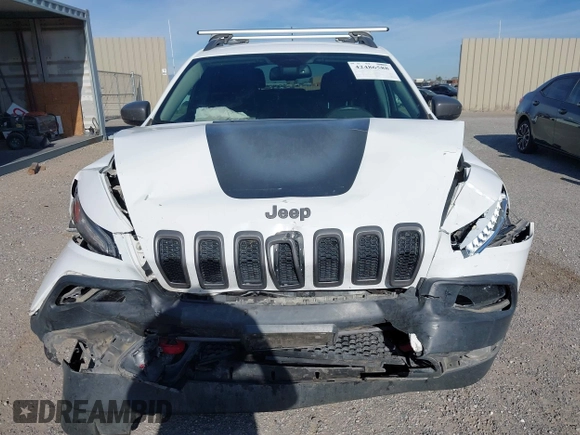 2017 Jeep Cherokee Trailhawk L Plus z VIN 1C4PJMBS1HD217370, wystawiony jako IAAI lot #42486588 z przebiegiem 108 695 mil mil oraz . Historia ofert i sprzedaży dostępna na DreamBid. Obrazek 12.
