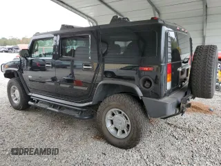 2003 Hummer H2 with VIN 5GRGN23U33H118459, listed as a Copart auction lot 77765694 with 157,390 mi miles and Salvage Title. Bid and sale history available at carsss.com. Image 2.