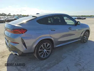 2025 BMW X6 xDrive40i z VIN 5UX33EX02S9W99295, wystawiony jako Copart lot #56997185 z przebiegiem 31 308 mil mil oraz Tytuł czysty. Historia ofert i sprzedaży dostępna na DreamBid. Obrazek 3.