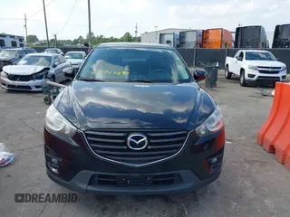2016 Mazda CX-5 Touring with VIN JM3KE2CY5G0653108, listed as a IAAI auction lot 37717249 with 90,704 mi miles and . Bid and sale history available at DreamBid. Image 13.