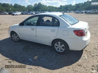 2010 Kia Rio LX with VIN KNADH4A31A6635895, listed as a Copart auction lot 61308434 with 209,016 mi miles and Salvage Title. Bid and sale history available at carsss.com. Image 2.