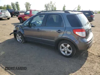2010 Suzuki SX4 with VIN JS2YB5A24A6300249, listed as a Copart auction lot 71565394 with 291,886 mi miles and Salvage Title. Bid and sale history available at DreamBid. Image 2.
