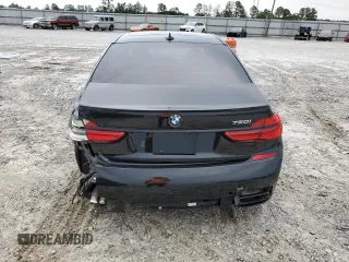 2019 BMW 7 Series 750i with VIN WBA7F0C57KGM25906, listed as a Copart auction lot 62728443 with 61,561 mi miles. Bid and sale history available at carsss.com. Image 6.