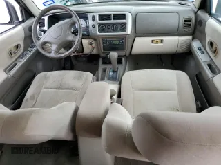 2004 Mitsubishi Montero z VIN JA4LS31R24J003157, wystawiony jako Copart lot #69761354 z przebiegiem 169 918 mil mil oraz Nie do naprawy. Historia ofert i sprzedaży dostępna na DreamBid. Obrazek 8.