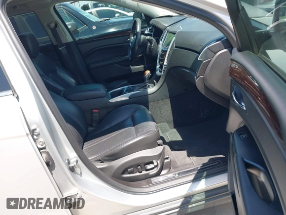 2015 Cadillac SRX Luxury Collection z VIN 3GYFNBE35FS627640, wystawiony jako IAAI lot #42262843 z przebiegiem 211 669 mil mil oraz . Historia ofert i sprzedaży dostępna na DreamBid. Obrazek 5.