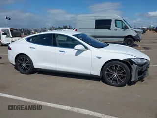 2014 Tesla Model S 60 with VIN 5YJSA1H10EFP56526, listed as a IAAI auction lot 41871784 with 143,361 mi miles and . Bid and sale history available at DreamBid. Image 14.