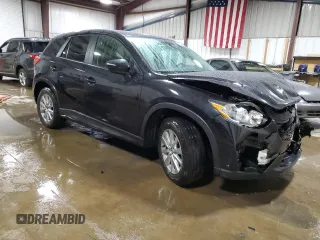 2016 Mazda CX-5 Touring with VIN JM3KE4CY0G0899611, listed as a Copart auction lot 52872915 with 76,801 mi miles and Salvage Title. Bid and sale history available at carsss.com. Image 4.