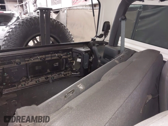 2020 Jeep Wrangler Sport S with VIN 1C4GJXAN4LW229040, listed as a IAAI auction lot 42172180 with 58,701 mi miles and . Bid and sale history available at DreamBid. Image 8.