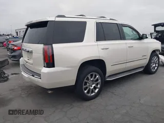 2015 GMC Yukon Denali with VIN 1GKS2CKJ9FR294551, listed as a IAAI auction lot 42162654 with 106,063 mi miles. Bid and sale history available at carsss.com. Image 4.