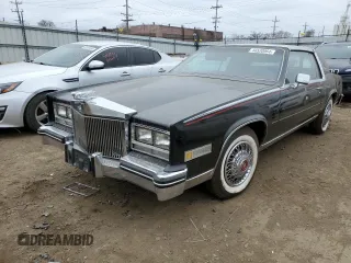 1985 Cadillac Eldorado z VIN 1G6EL5782FE634074, wystawiony jako Copart lot #44520964 z przebiegiem 74 425 mil mil oraz Szkody całkowita. Historia ofert i sprzedaży dostępna na DreamBid. Obrazek 1.