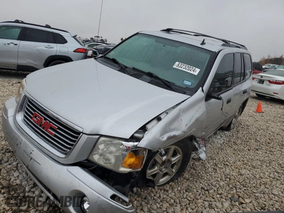 2009 GMC Envoy SLE with VIN 1GKDS33S492129469, listed as a Copart auction lot 83232024 with 131,735 mi miles and Salvage Title. Bid and sale history available at carsss.com. Image 1.