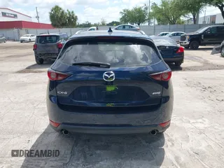 2017 Mazda CX-5 Touring with VIN JM3KFACL0H0227615, listed as a IAAI auction lot 42063618 with 72,291 mi miles. Bid and sale history available at carsss.com. Image 16.