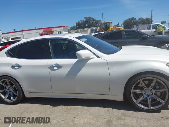 2013 Infiniti M with VIN JN1BY1AP6DM511104, listed as a IAAI auction lot 41818184 with 138,605 mi miles and . Bid and sale history available at DreamBid. Image 14.