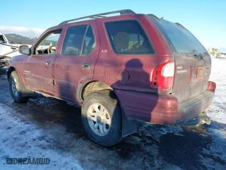 2002 Isuzu Rodeo with VIN 4S2DM58W124319936, listed as a IAAI auction lot 41555285 with 143,035 mi miles. Bid and sale history available at carsss.com. Image 3.
