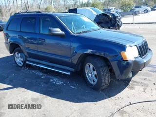 2009 Jeep Grand Cherokee Laredo with VIN 1J8HR48P19C540785, listed as a IAAI auction lot 41729851 with 205,504 mi miles. Bid and sale history available at carsss.com. Image 1.