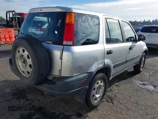 2000 Honda CR-V LX with VIN JHLRD184XYC054038, listed as a IAAI auction lot 41414445 with 294,210 mi miles. Bid and sale history available at carsss.com. Image 4.