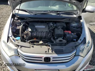 2010 Honda Insight EX z VIN JHMZE2H74AS034758, wystawiony jako Copart lot #52905445 z przebiegiem 154 148 mil mil oraz Szkoda całkowita • Salvage title. Historia ofert i sprzedaży dostępna na DreamBid. Obrazek 11.
