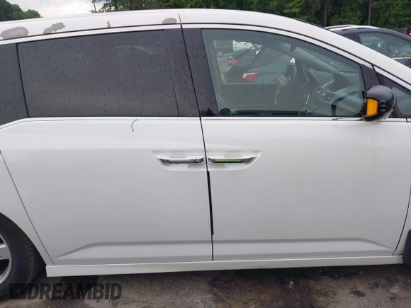 2012 Honda Odyssey Touring with VIN 5FNRL5H93CB034485, listed as a IAAI auction lot 42304502 with 198,589 mi miles and . Bid and sale history available at DreamBid. Image 13.