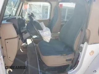 2000 Jeep Wrangler Sahara with VIN 1J4FA59SXYP764539, listed as a Copart auction lot 52707385 with 136,159 mi miles and Salvage title. Bid and sale history available at DreamBid. Image 7.