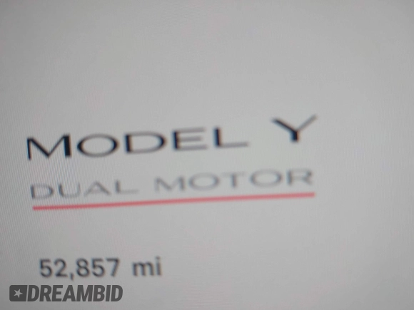 2023 Tesla Model Y Performance with VIN 7SAYGDEF9PF582908, listed as a IAAI auction lot 41930957 with 52,857 mi miles and . Bid and sale history available at DreamBid. Image 14.