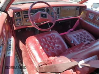 1981 Cadillac Eldorado z VIN 1G6AL5799BE630301, wystawiony jako Copart lot #55995155 z przebiegiem 49 072 mil mil oraz Tytuł czysty. Historia ofert i sprzedaży dostępna na DreamBid. Obrazek 8.