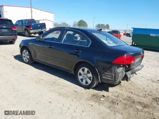 2009 Kia Optima LX with VIN KNAGE228895356661, listed as a IAAI auction lot 41821857 with 124,692 mi miles. Bid and sale history available at carsss.com. Image 3.
